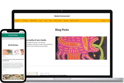 An academic article on a phone and laptop.